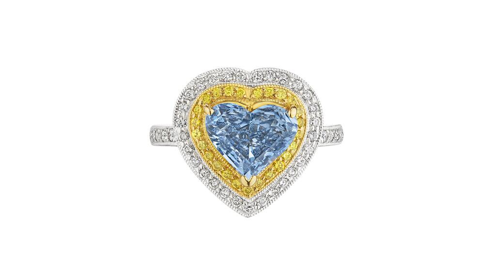 This platinum ring featuring a 2.28-carat fancy vivid blue heart-shaped diamond surrounded by yellow and white diamonds sold for $2.1 million at Christie’s Tuesday. Fancy vivid blue heart-shaped diamond ring